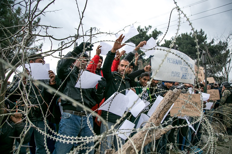 Refugees from Iran, Bangladesh and Pakistan asking to cross the border from Greece into Macedonia