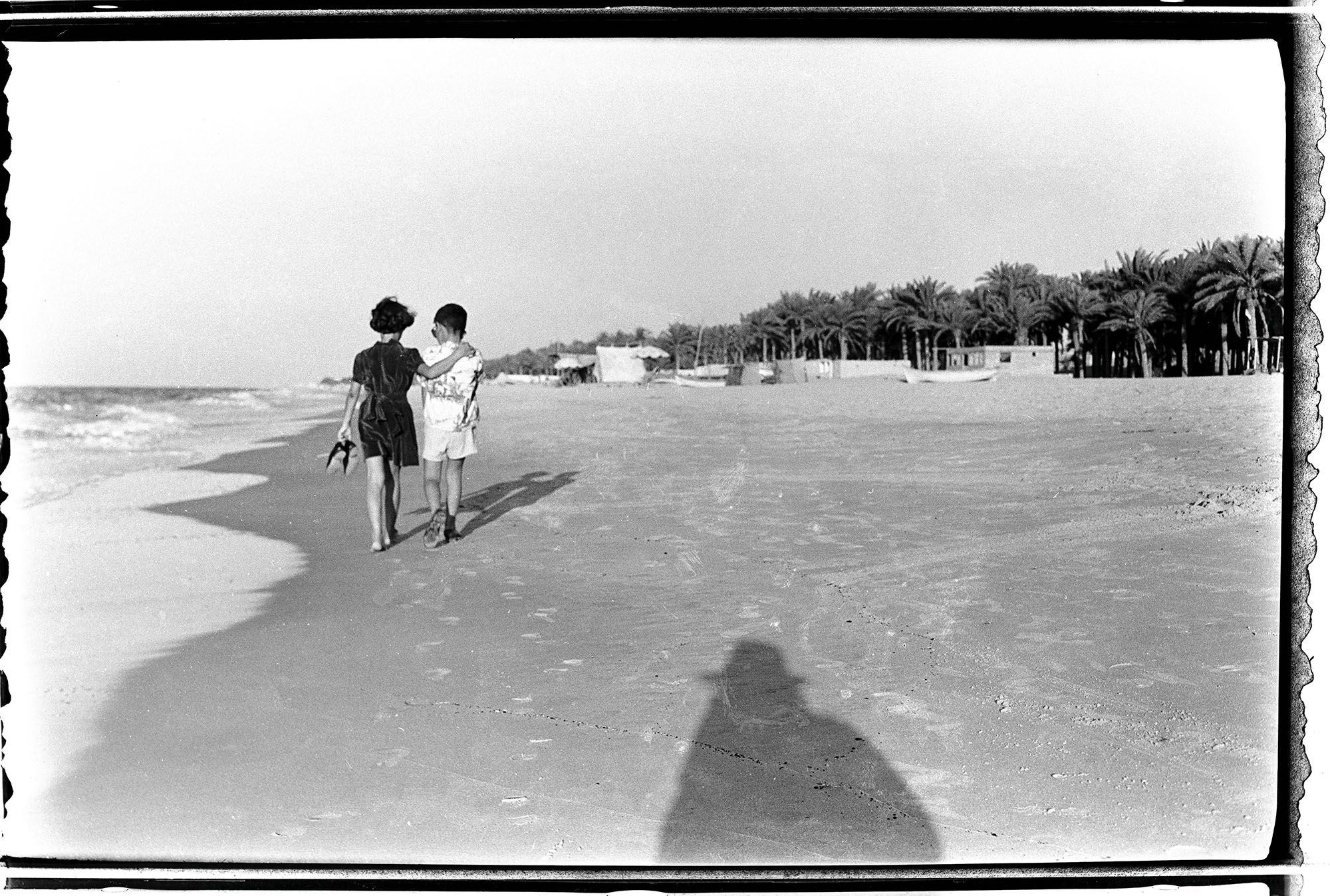 A photograph by Kegham Djeghalian of his children walking along the beach in Gaza