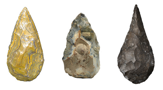 From left to right, iron stone handaxe from Kathu Pan, South Africa, c.600,000 BCE; the West Tofts handaxe, knapped around a fossil shell; handaxe from Gesher Benot Ya’aqov, Israel c.780,000 BCE.