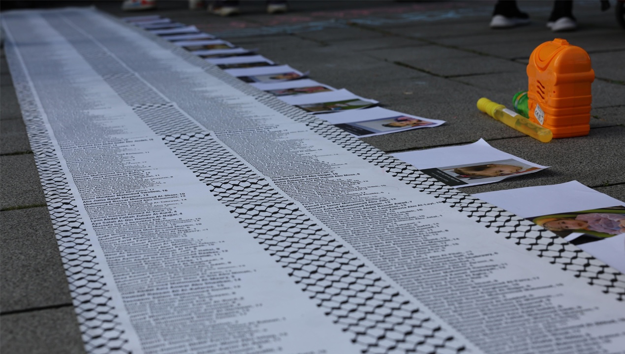 A list of the names of some of the thousands of children killed in Gaza, unrolled at a protest outside the DSEI arms fair at the Excel centre in London, 9 September 2025 (Pete Speller, Alamy)
